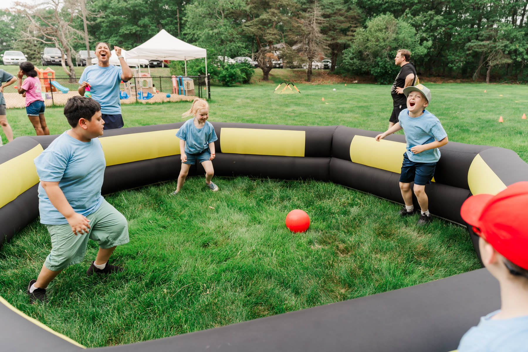 Students laughing during a game of gaga ball